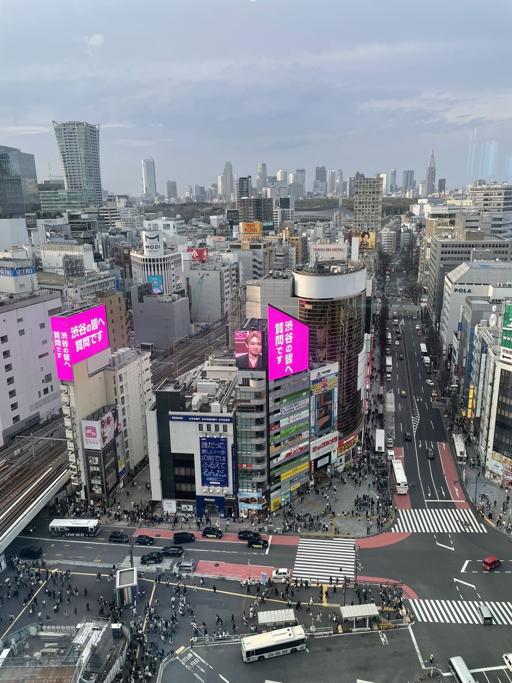 Shibuya from above, streets and billboards far below